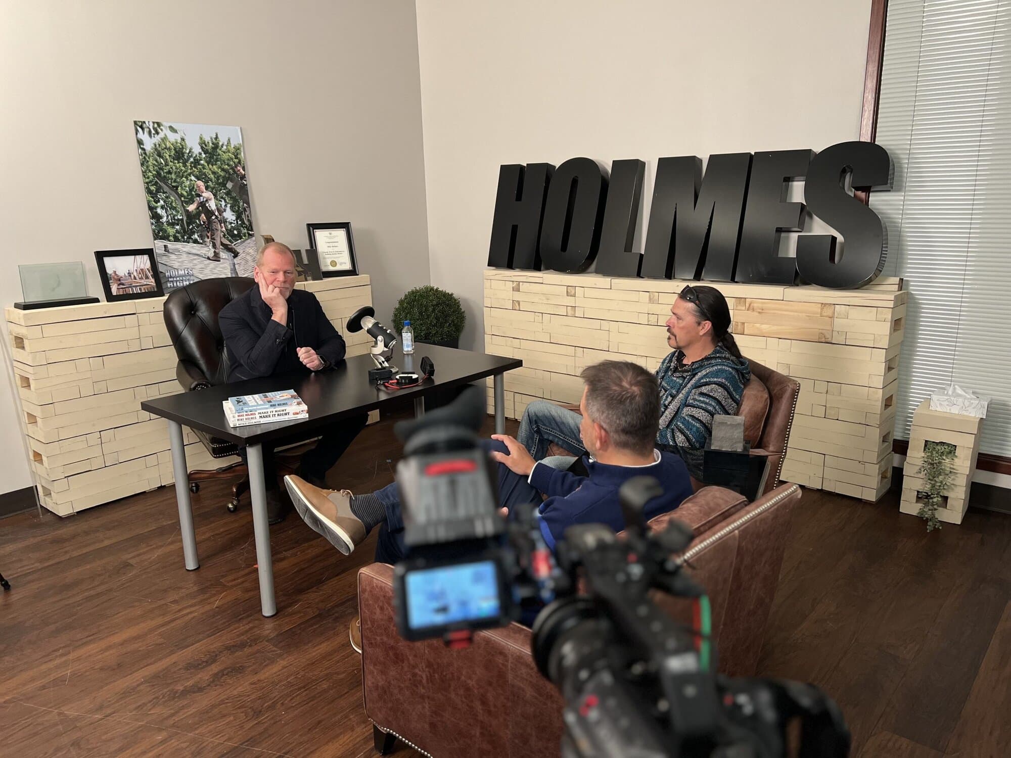 Infinity Forge founders being interviewed by Mike Holmes on camera at the Holmes studio